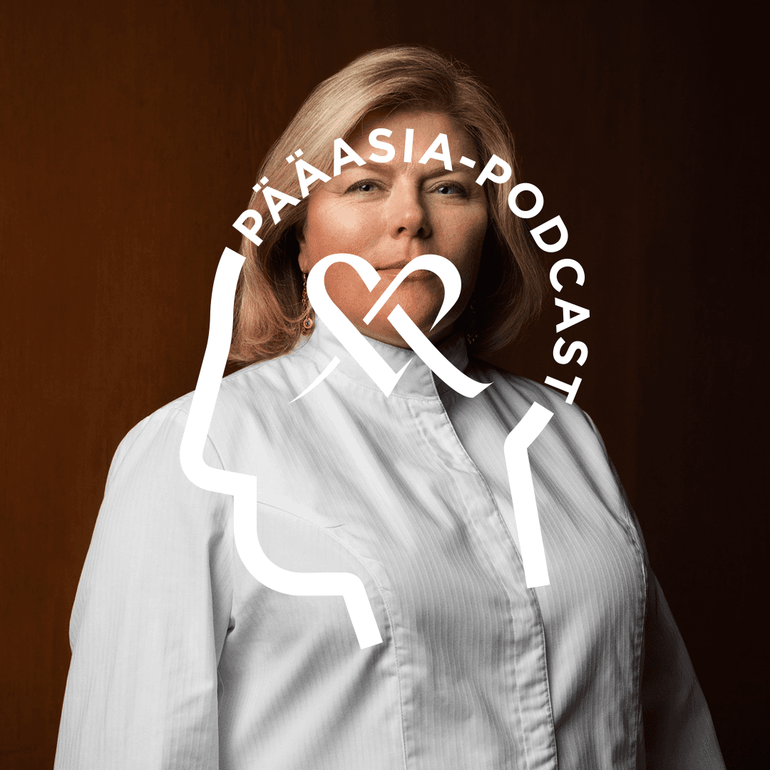 Helena Puolakka poses for the camera in a close-up shot. Overlaid on the image is the *Pääasia* podcast logo, featuring text shaped like a human head and the Mehiläinen heart symbol in the center.